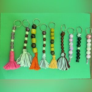 Jewelry, beaded homemade bracelets, keychains and Tassel earrings.